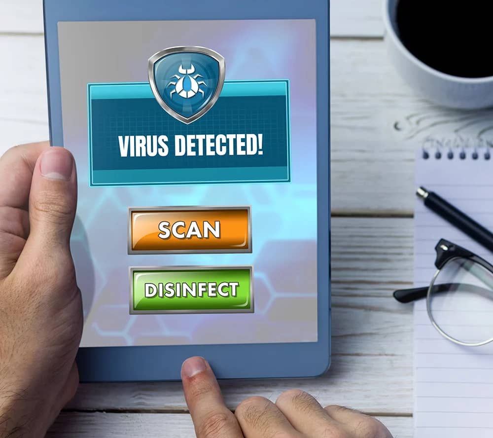ipad screen showing virus detected with two buttons to scan or disinfect