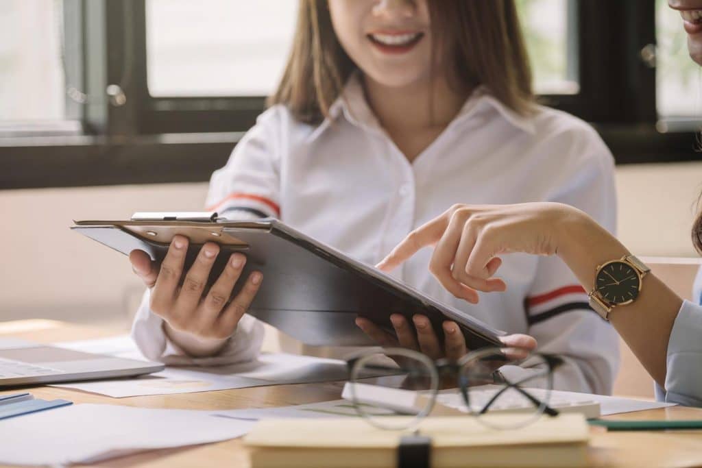 Young business teamwork working with business report document on office desk