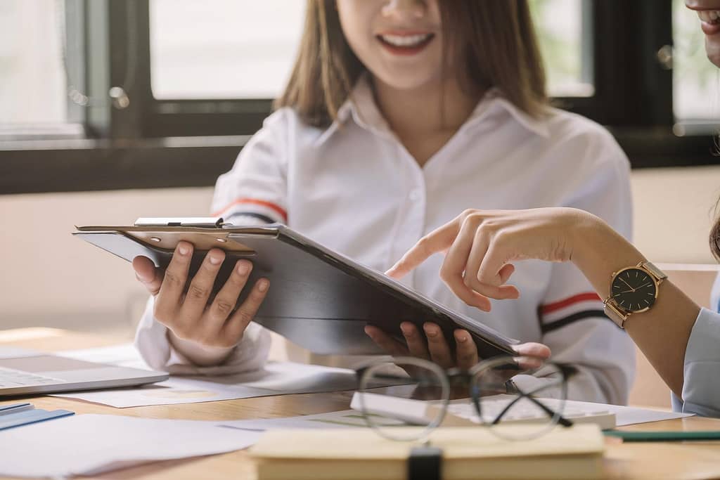 Young business teamwork working with business report document on office desk
