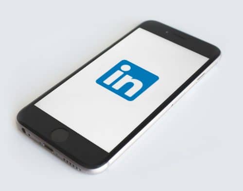 smartphone showing linkedin logo smartphone showing linkedin logo