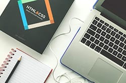 html & css book and laptop