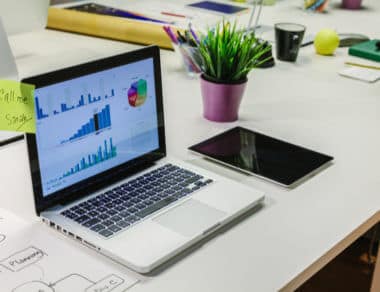 ipad and laptop on a desk