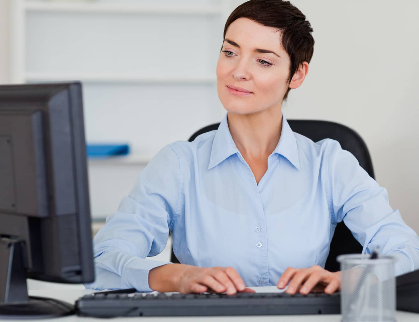 cute businesswoman typing with her computer cute businesswoman typing with her computer